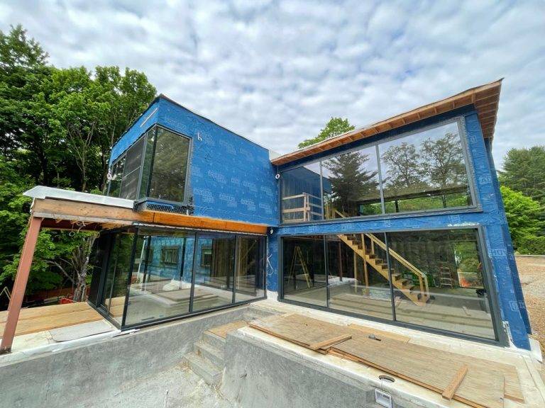 Residential installation of premium aluminum windows and modern lift & slide door systems in Scarsdale, NY.