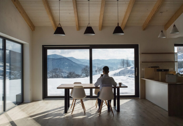 Large-format sliding systems by Eco Windows bring panoramic views inside while maintaining full Passive House thermal performance.